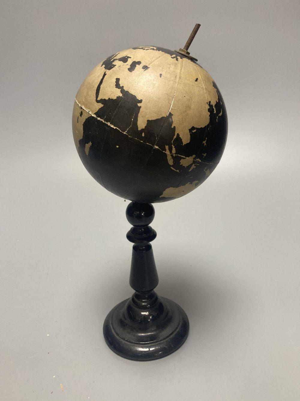 A Reliable Series lithographed tinplate revolving globe, 20cm, and two graphic globes,on ebonised wood bases, one by Philips